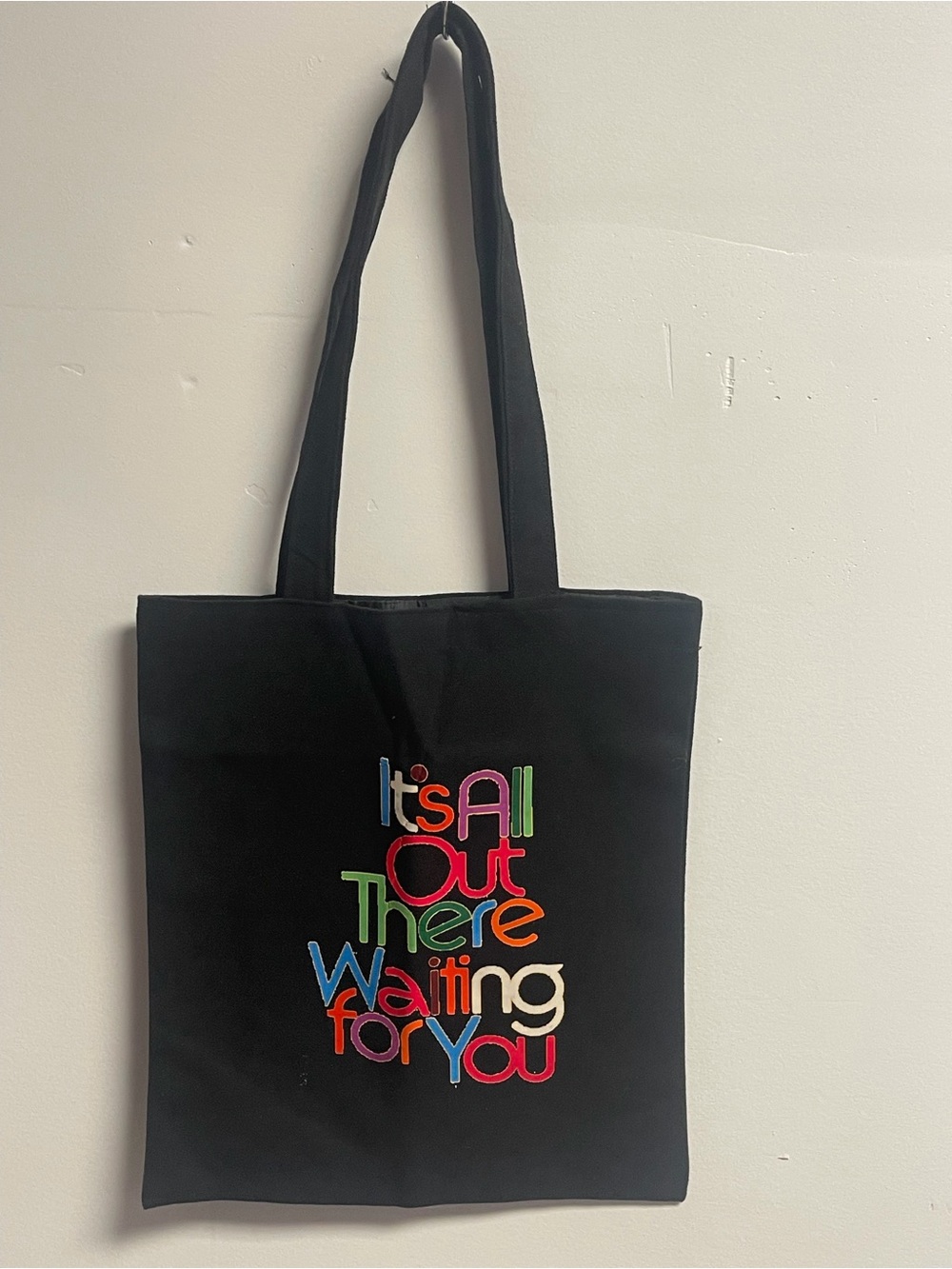 Black Canvas Tote Bag with Colorful 'It's All Out There Waiting for You' Graphic